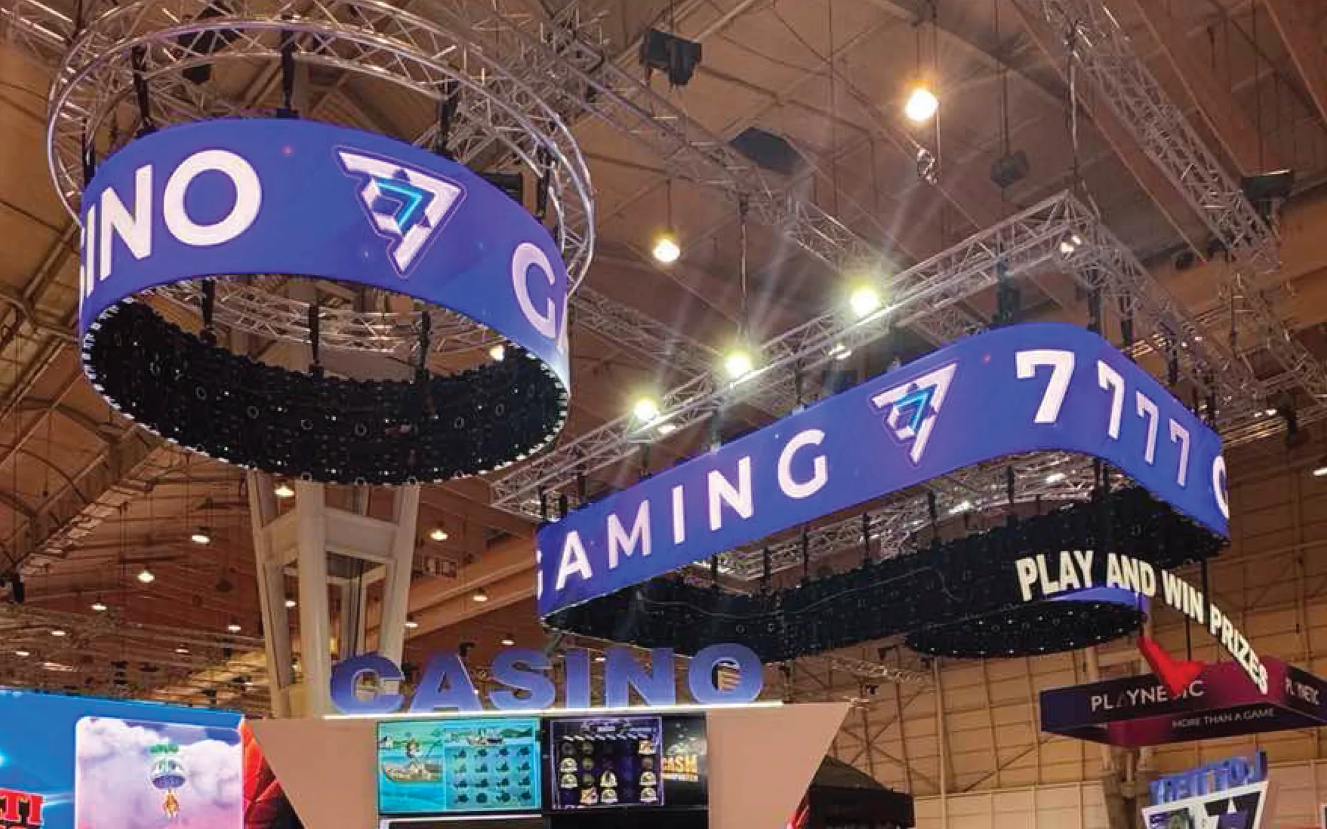 Custom curved LED displays suspended above an exhibition stand